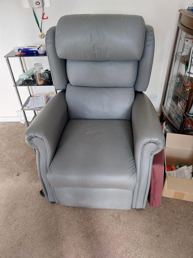 Preview of the first image of Faux leather grey riser recliner chair.