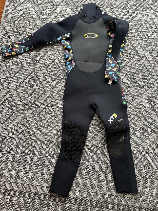 Preview of the first image of Brand new wetsuit age 7-8.
