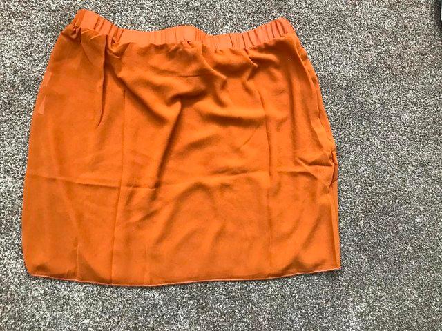 Preview of the first image of UNIQUE 21 TULIP BEACH SKIRT IN ORANGE SIZE 14.