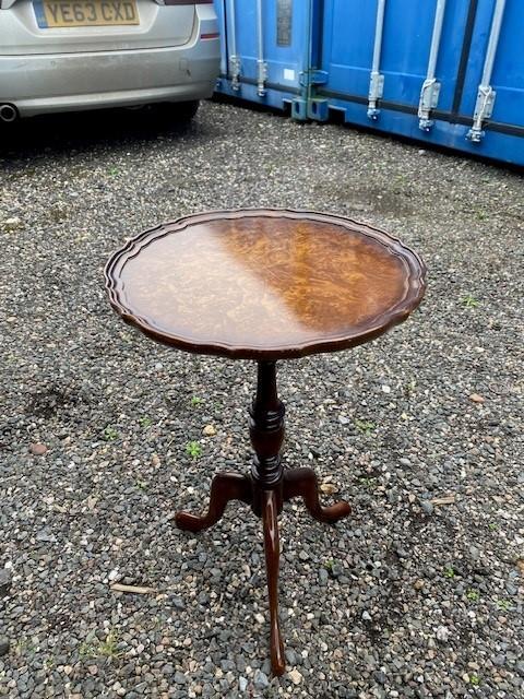 Preview of the first image of vintage small round polished wood occasional table.