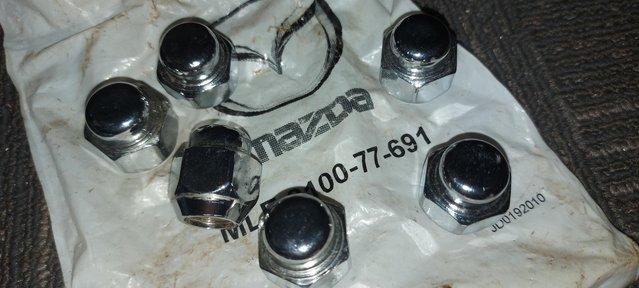 Preview of the first image of Mazda mx5 chrome wheel nuts ,genuine Mazda fits 2002 sport.