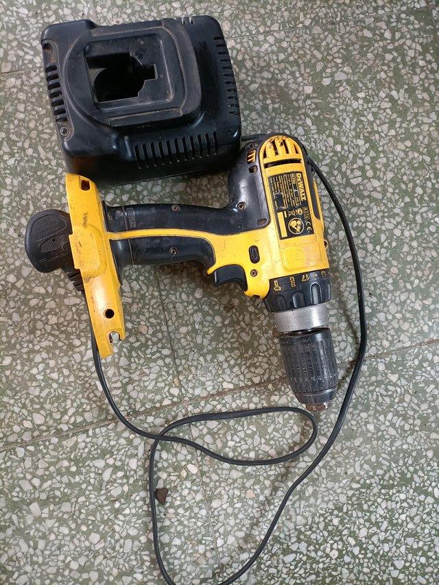 Preview of the first image of DeWalt DC725 18 volt hammer drill bare unit and charger.