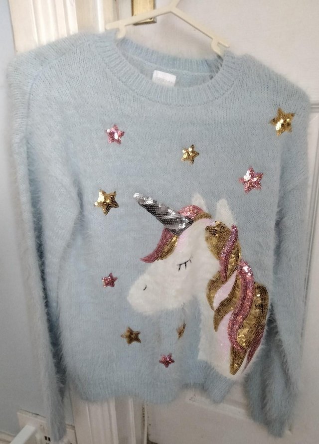 Preview of the first image of Girls mo hair style unicorn jumper size 9/10.