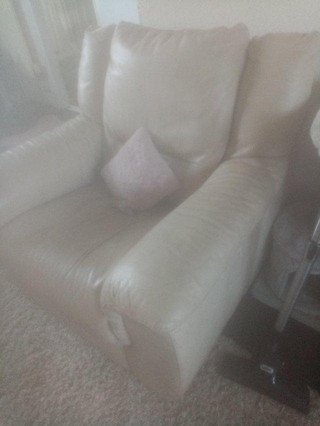 Preview of the first image of Cream leather used armchair for sale.
