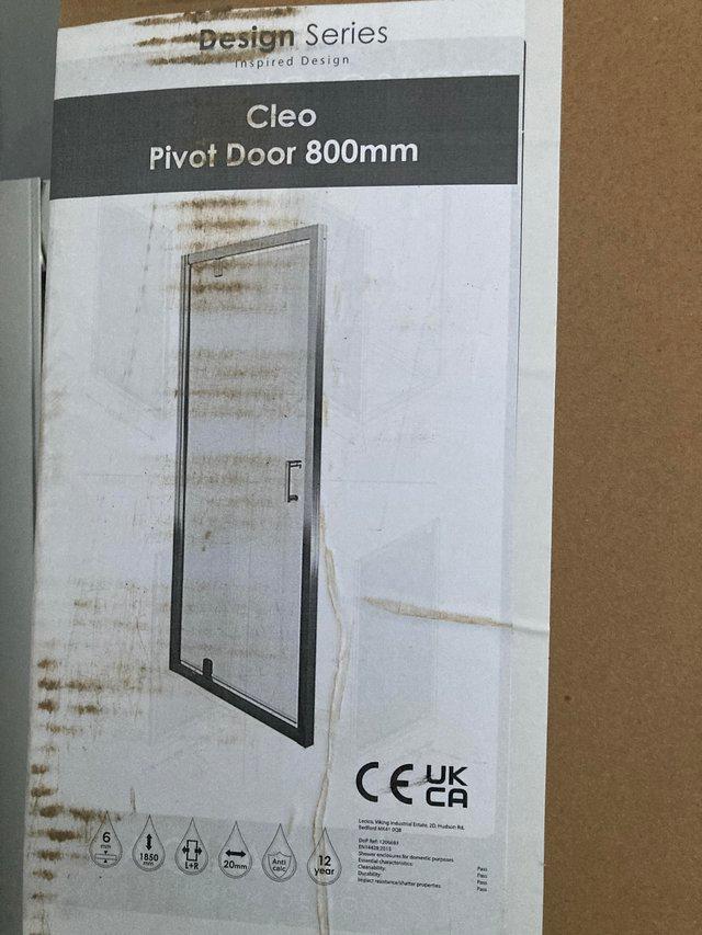 Preview of the first image of Brand New 800 Pivot Glass shower Door.
