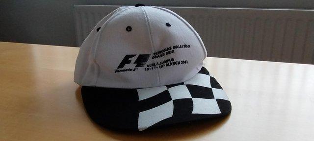 Preview of the first image of Formula1 official programmes+Formula1 Mayalsian baseball cap.