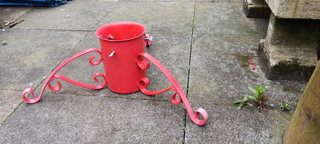 Preview of the first image of Red metal Christmas tree stand in excellent condition.