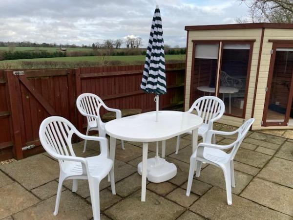 Image 2 of Garden table, chairs and parasol