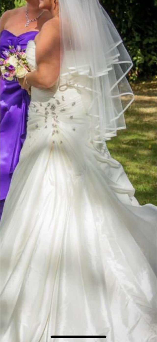 Preview of the first image of Designer wedding dress for sale.