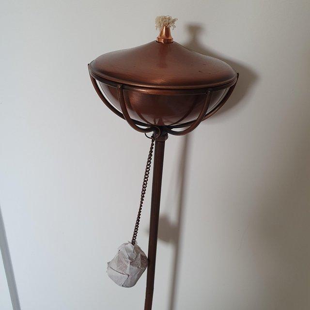 Preview of the first image of 9 available. Antique Copper effect oil burners on stake.