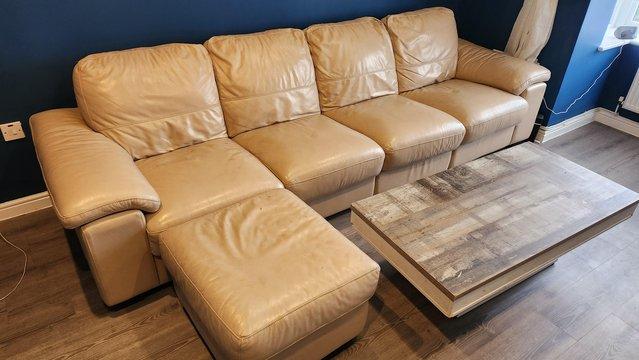 Image 1 of 4 seater Leather sofa and foot stool