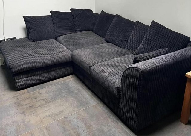 Preview of the first image of Dunelm Black l shape corner sofa.