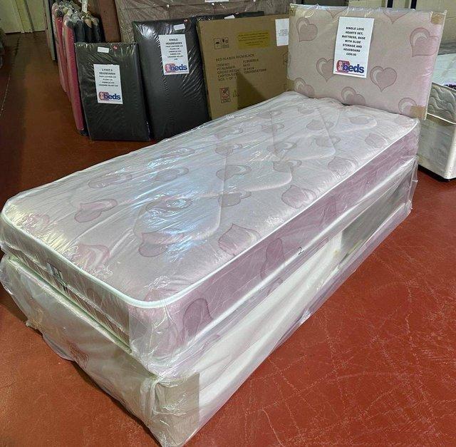 Preview of the first image of SINGLE PINK LOVE HEARTS SLIDE STORAGE DIVAN BED DEAL.