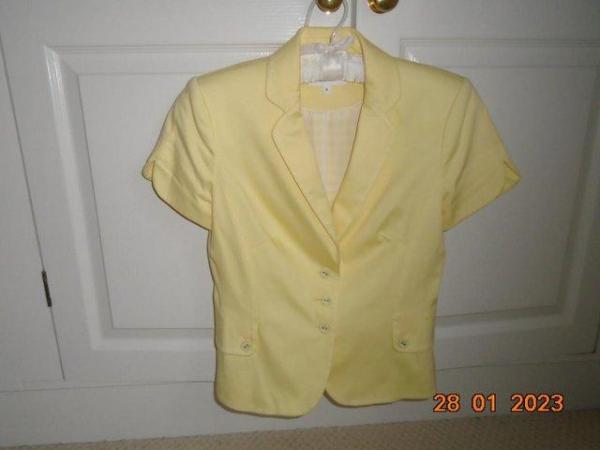 Image 1 of Pale yellow short sleeved fitted cotton jacket