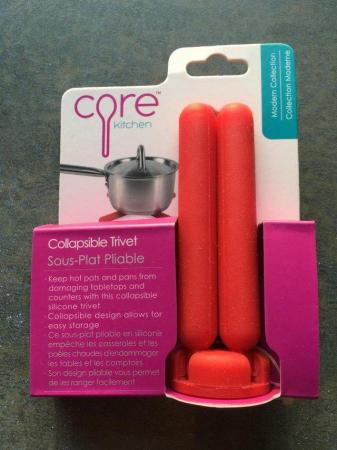 Image 1 of NEW red Core silicone collapsible trivet, original packaging