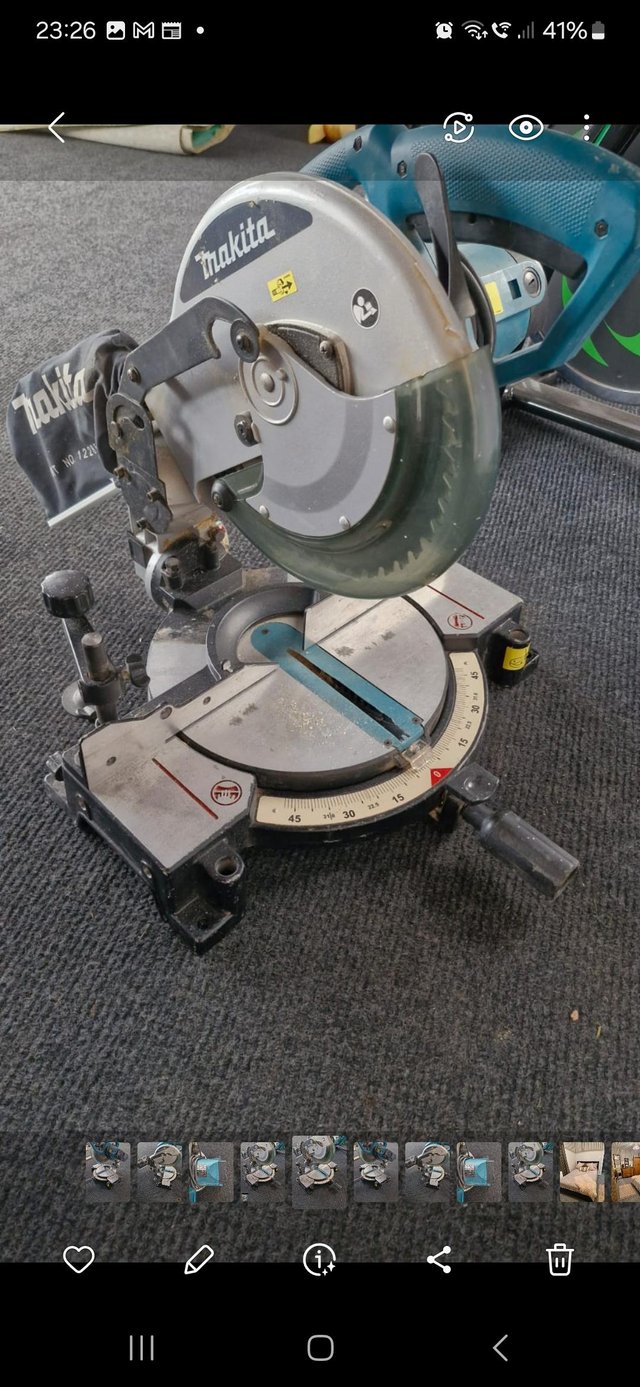 Preview of the first image of Makita MLS100 mitre saw with blade.