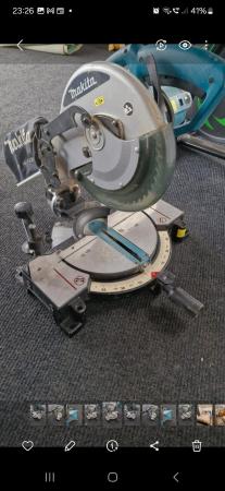 Image 1 of Makita MLS100 mitre saw with blade