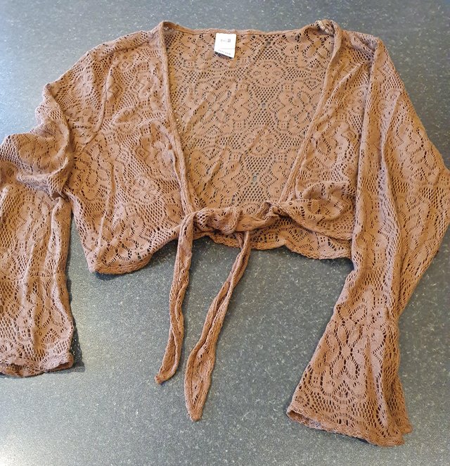 Preview of the first image of Plus size cropped brown crochet cardigan, size 22/24.