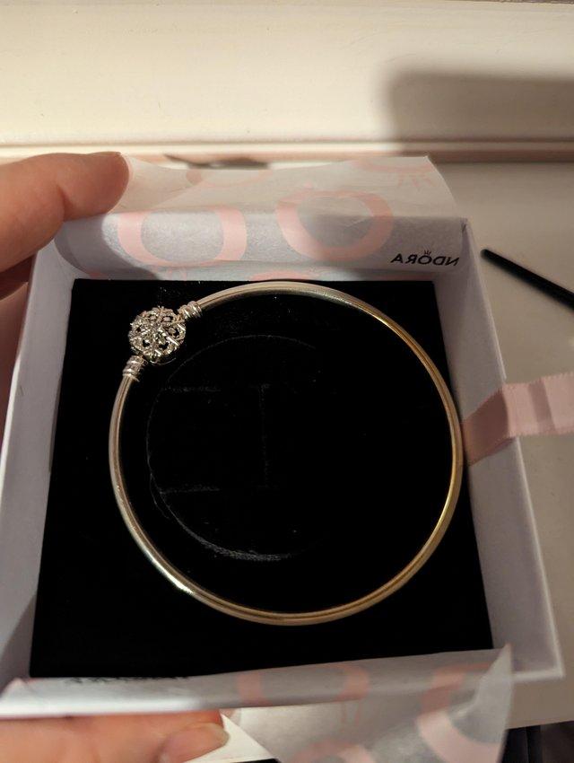 Preview of the first image of Genuine Pandora Bangle, never worn.