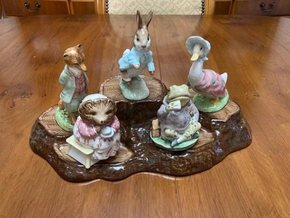 Image 1 of Beatrix Potter figurines and snow globes