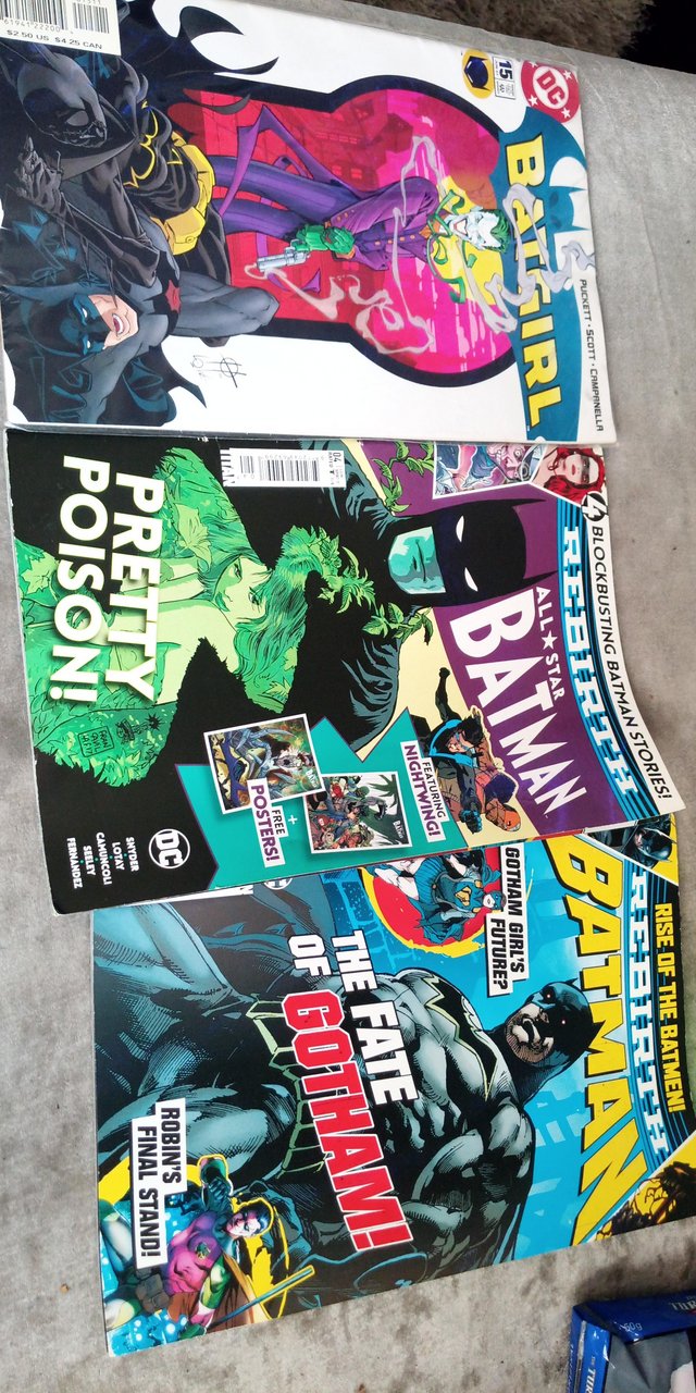 Preview of the first image of 2 Batman comets and 1 Batgirl comic.
