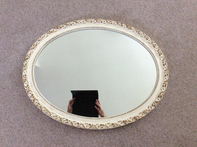 Preview of the first image of Vintage style oval mirror with gold detail.