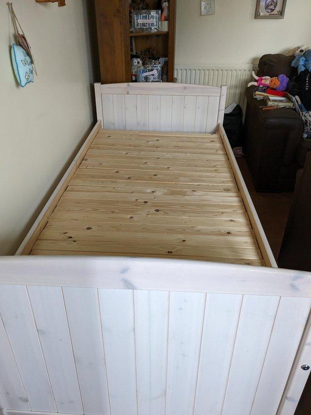 Preview of the first image of Wooden child bed with drawers no mattress si.