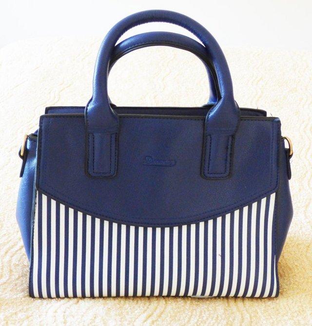 Preview of the first image of BRAND NEW BLUE & WHITE STRIPED HANDBAG.