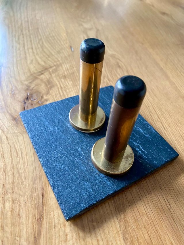 Preview of the first image of Aged Solid Brass Door Stops - One Pair.