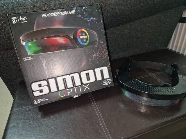 Preview of the first image of HASBRO SIMON 'OPTIX' ELECTRONIC GAME.