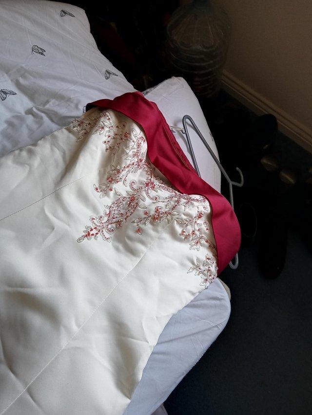 Preview of the first image of Ivory and burgundy wedding dress.