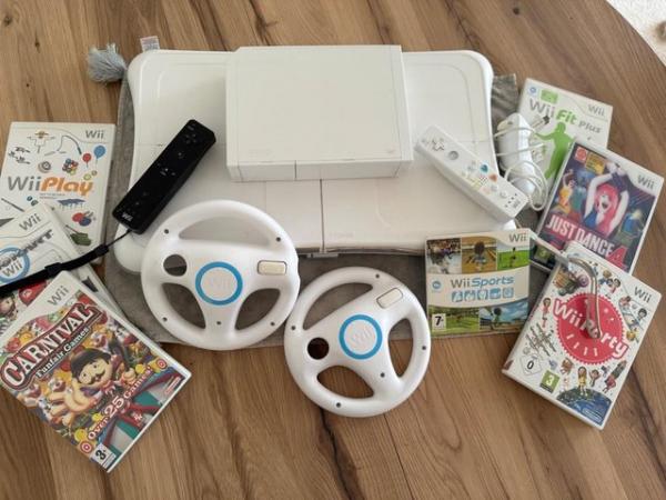 Image 1 of Nintendo Wii console, balance board & controllers and games