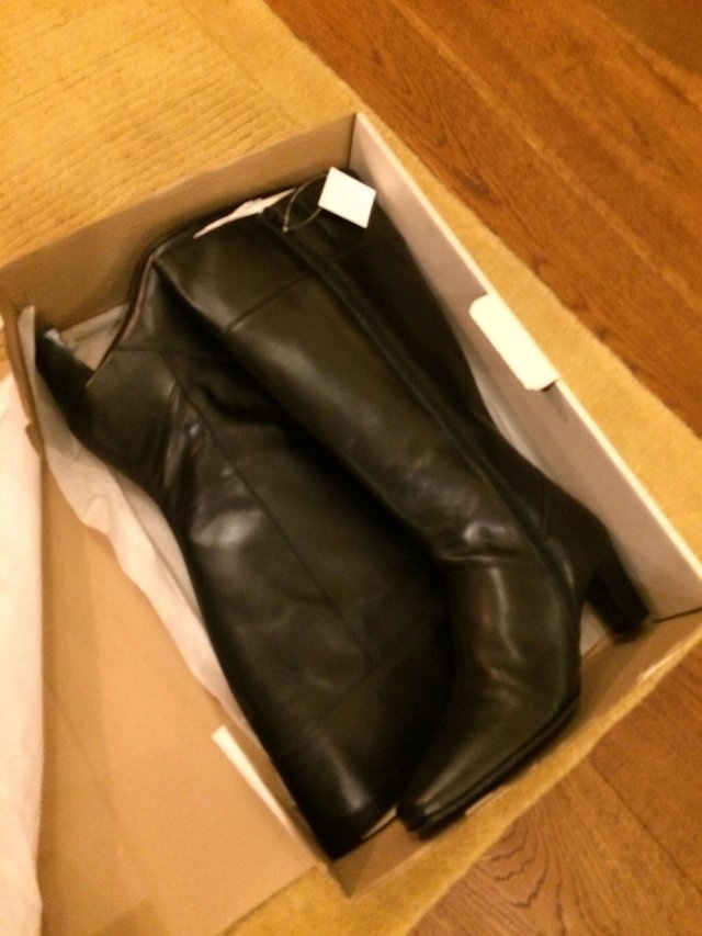 Preview of the first image of WIDE CALF KNEE LENGTH HIGH POLISH LEATHER BOOTS.