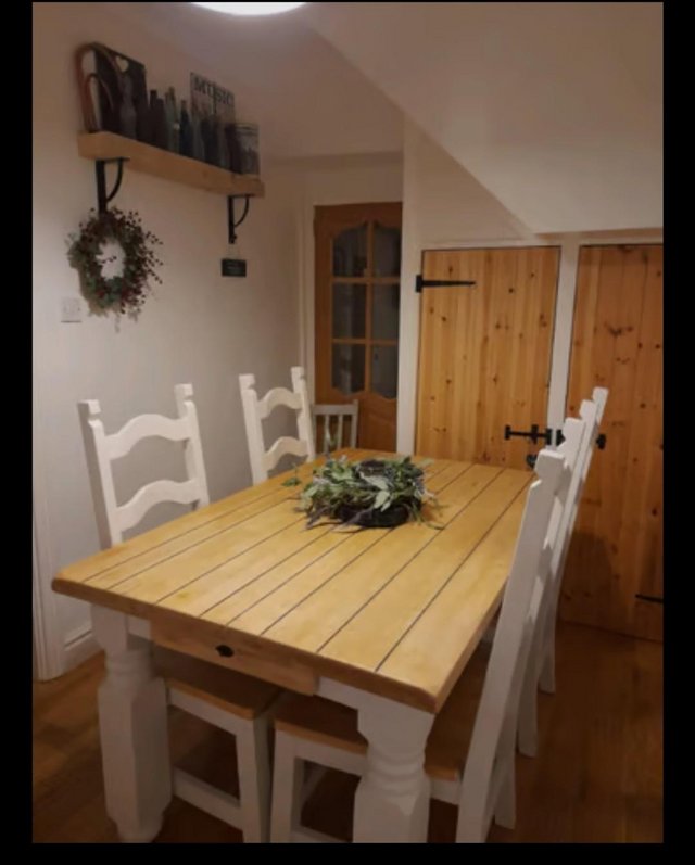 Preview of the first image of Solid wooden table and chairs for sale.