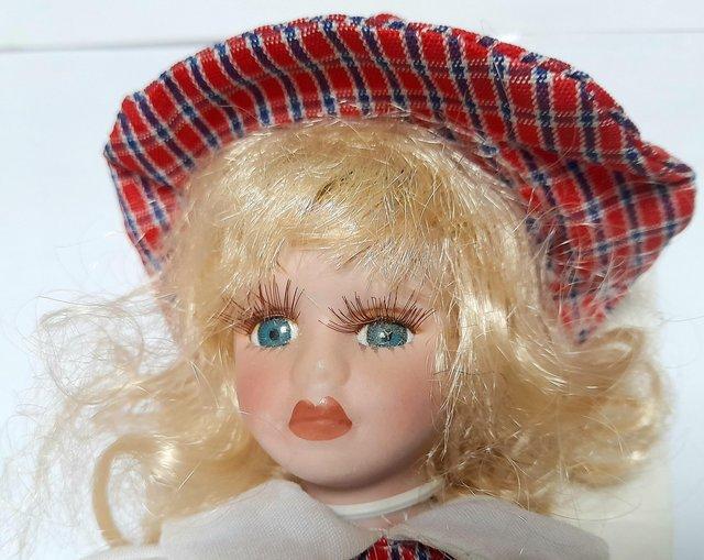 Preview of the first image of BOXED PORCELAIN DOLL - ROSIE - RED CHECK DRESS - 16 cm.