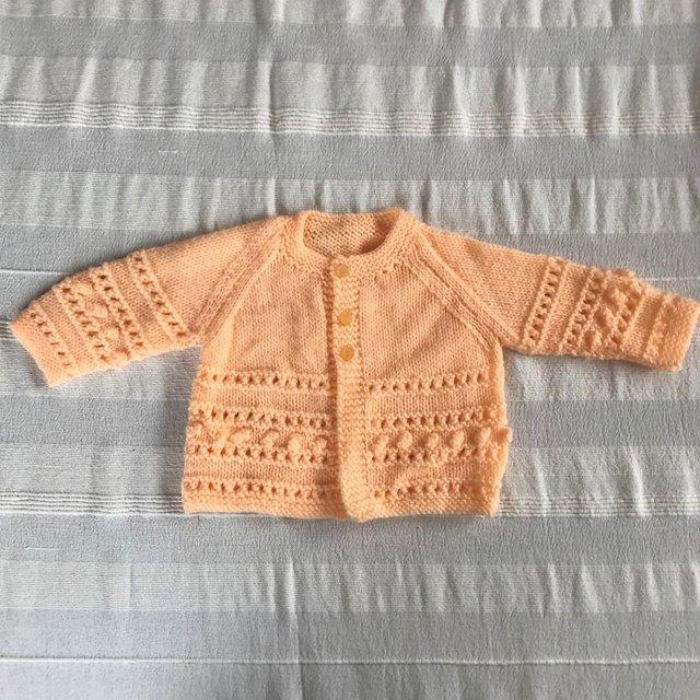 Preview of the first image of UNWORN vintage 1990's peach hand-knitted matinee jacket..