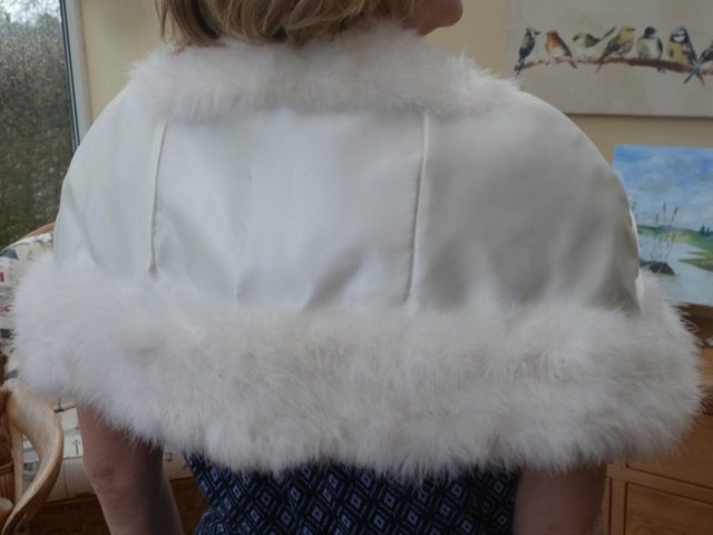 Preview of the first image of Shoulder Capes for bride and bridesmaid in white.
