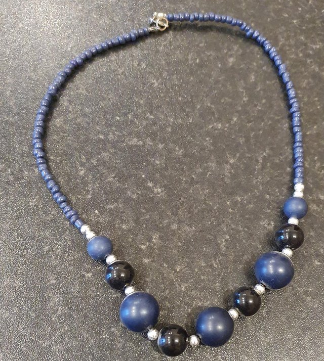 Preview of the first image of Navy bead costume necklace.