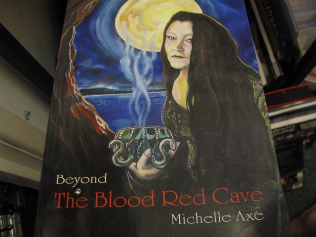 Preview of the first image of Michelle axe beyond the blood red cave signed book 2013.