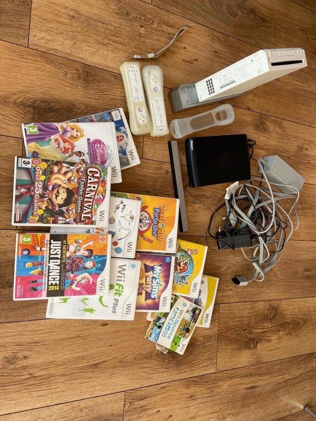 Preview of the first image of Nintendo Wii with 11 games & many discs.