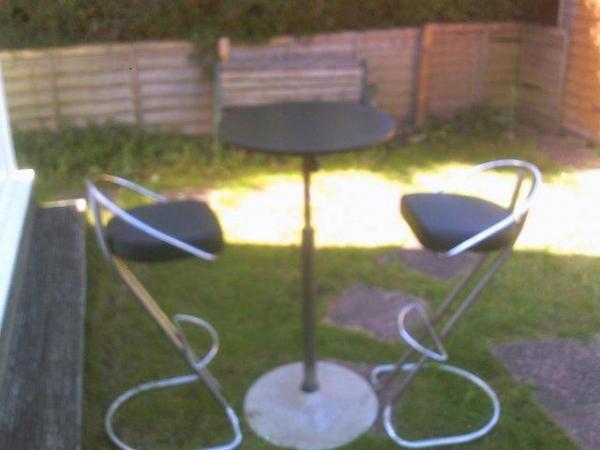 Image 1 of black revolving table and 4chairs