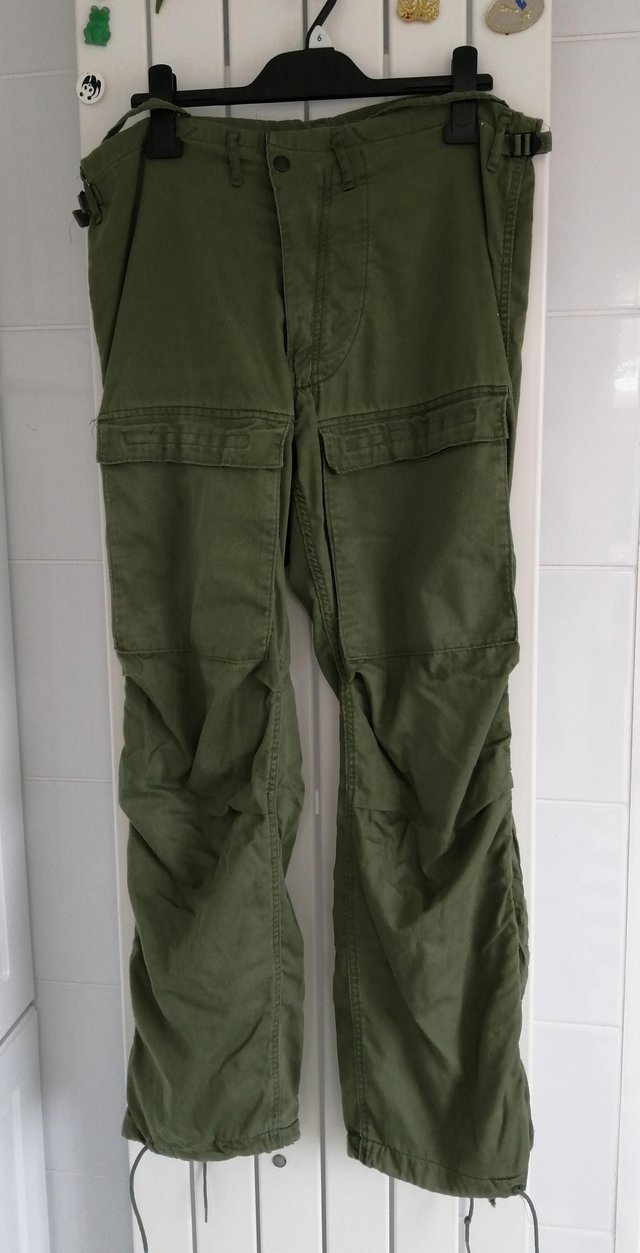 Preview of the first image of Ex-Forces Green Cargo Trousers.  Waist 30" to 36"..