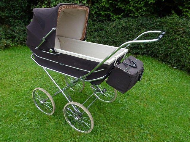 Preview of the first image of Brown Marmet pram with pram bag.