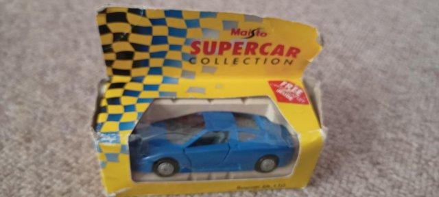 Preview of the first image of boxed maisto supercar collection bugatti eb 110 toy car.