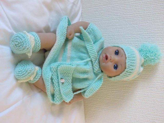 Preview of the first image of dolls soft bodied with knitted clothes.