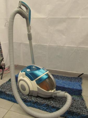 Image 1 of LG cylinder vacuum cleaner with tools.