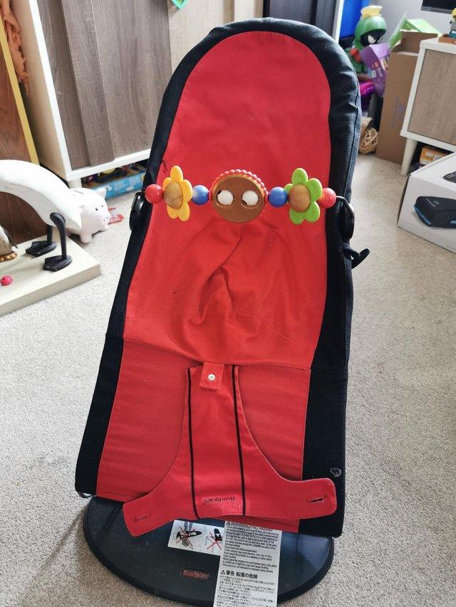 Preview of the first image of Baby Bjorn bouncer with toy attachment.