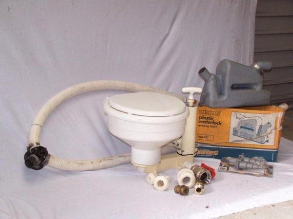 Image 1 of Sea-toilet and various plumbing items.