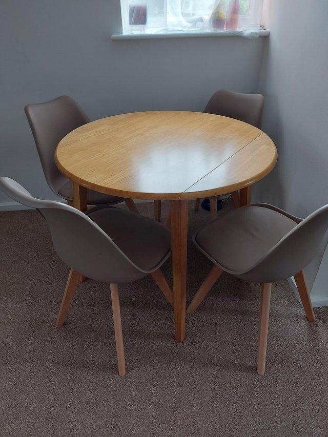 Preview of the first image of Round dining room table and chairs.
