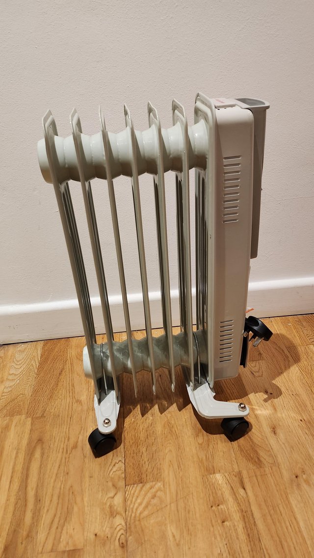 Preview of the first image of Oil Filled 1500 W Radiator (7 Fin) LIKE NEW (Still with Box).